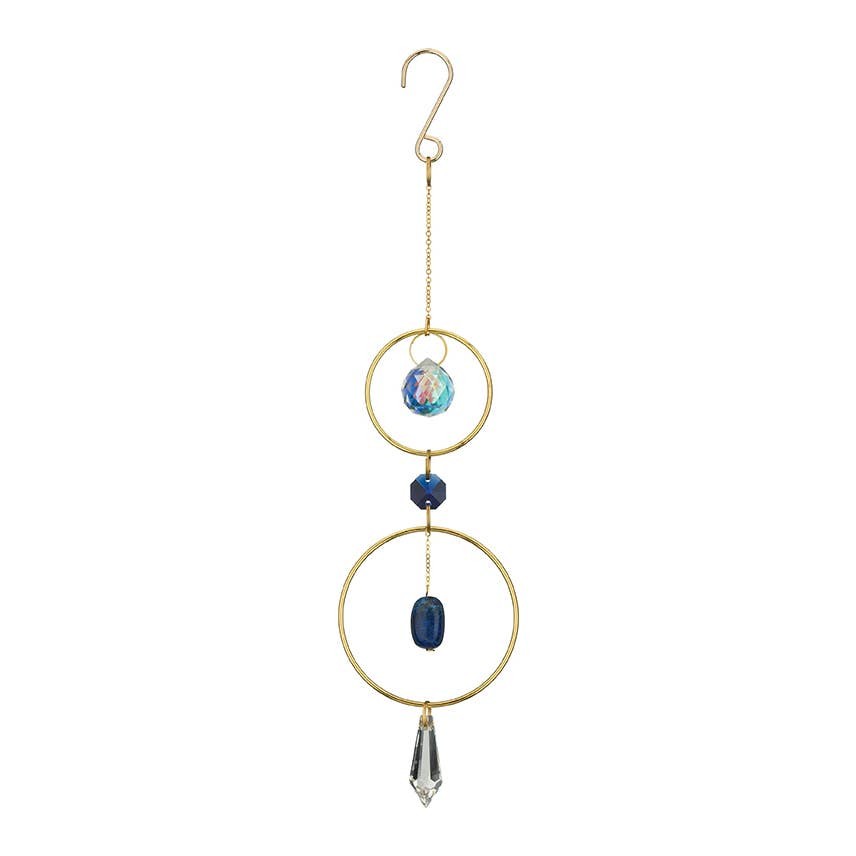 Mellow Monkey Lapiz healing suncatcher with blue gemstones and clear crystals suspended in bronze rings.