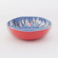 Mellow Monkey large melamine bowl with a red exterior and a blue interior featuring a "Race Day" sailboat pattern. Dishwasher safe.