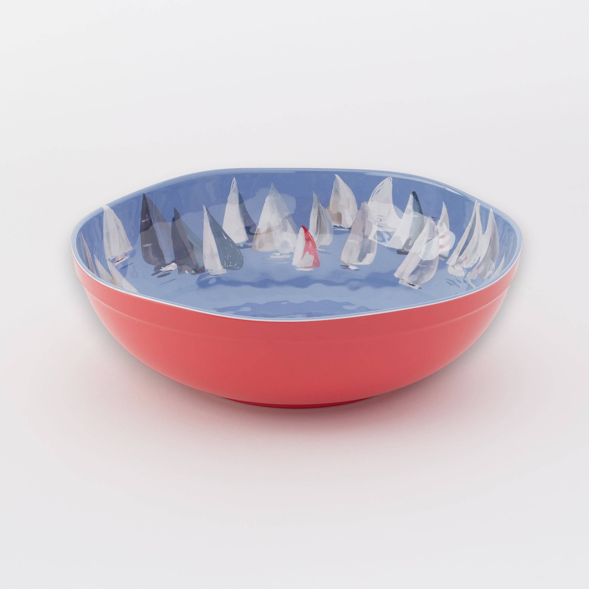 Mellow Monkey large melamine bowl with a red exterior and a blue interior featuring a "Race Day" sailboat pattern. Dishwasher safe.