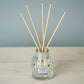 Mellow Monkey Pet House reed diffuser in Lavender Green Tea scent with paw print label in a glass bottle