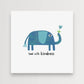 Mellow Monkey Lead with Kindness framed art print featuring a blue elephant holding a blue flower.