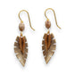 Mellow Monkey leaf-shaped drop earrings with textured gold-tone metal, brown accents, and surgical steel ear wires.
