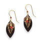 Mellow Monkey Leaf On Warm Oval earrings featuring bronze leaf charms, red beads, and surgical steel ear wires.