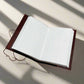 Mellow Monkey reddish-brown leather journal with elemental symbols and cord closure, 6"x9"