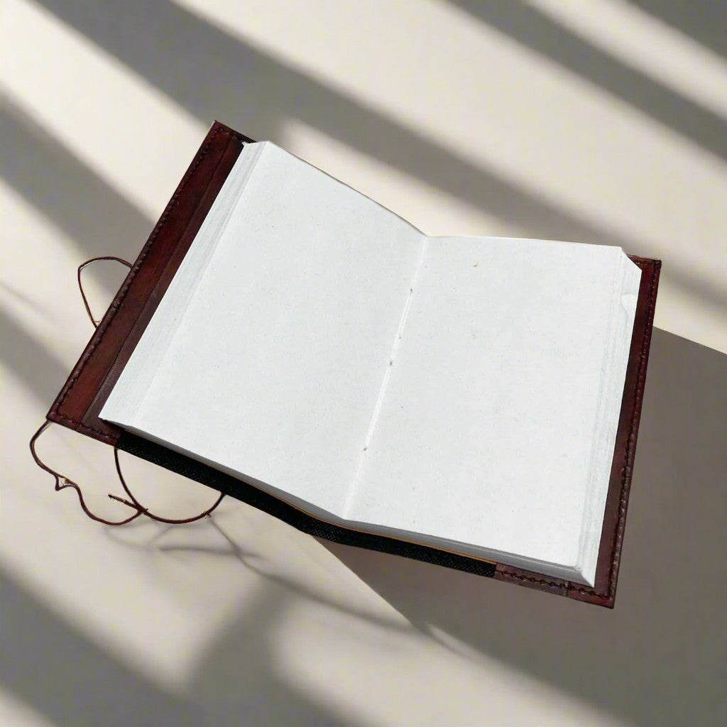 Mellow Monkey reddish-brown leather journal with elemental symbols and cord closure, 6"x9"