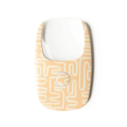 Mellow Monkey LED pocket magnifier with 2X magnification and a maze-like pattern in cream and beige.