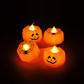 Mellow Monkey set of four orange plastic LED pumpkin jack-o'-lantern tealights with spiderweb and face designs.