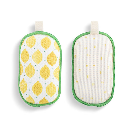 Mellow Monkey set of two reversible absorbent kitchen sponges featuring a yellow lemon pattern and green trim.