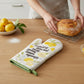 Mellow Monkey white oven mitt with lemons and the phrase "in fact it was not easy peasy lemon squeezy"