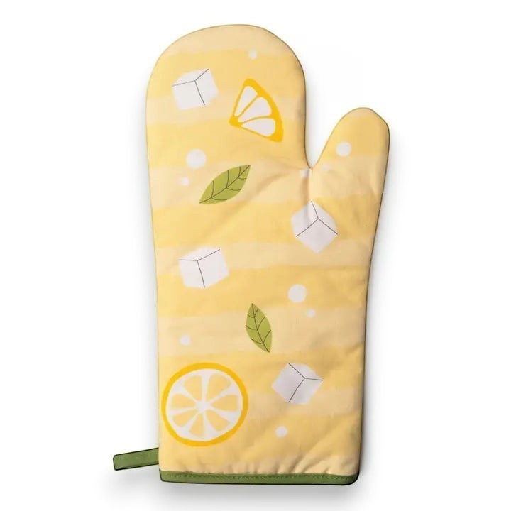 Mellow Monkey yellow oven mitt with lemon slices, ice cubes, and mint leaves pattern. Heat resistant up to 450F.