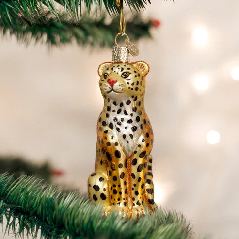Mellow Monkey Leopard Old World Christmas blown glass ornament, gold with black spots, sitting pose.