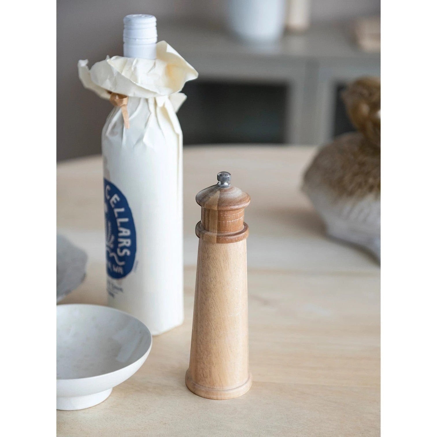 Mellow Monkey 8-inch lighthouse shaped salt and pepper mill made of natural rubberwood.