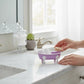Mellow Monkey Lilac Iron Bathtub Soap Dish with white feet and rim, holding small soap bar and rolled towels.