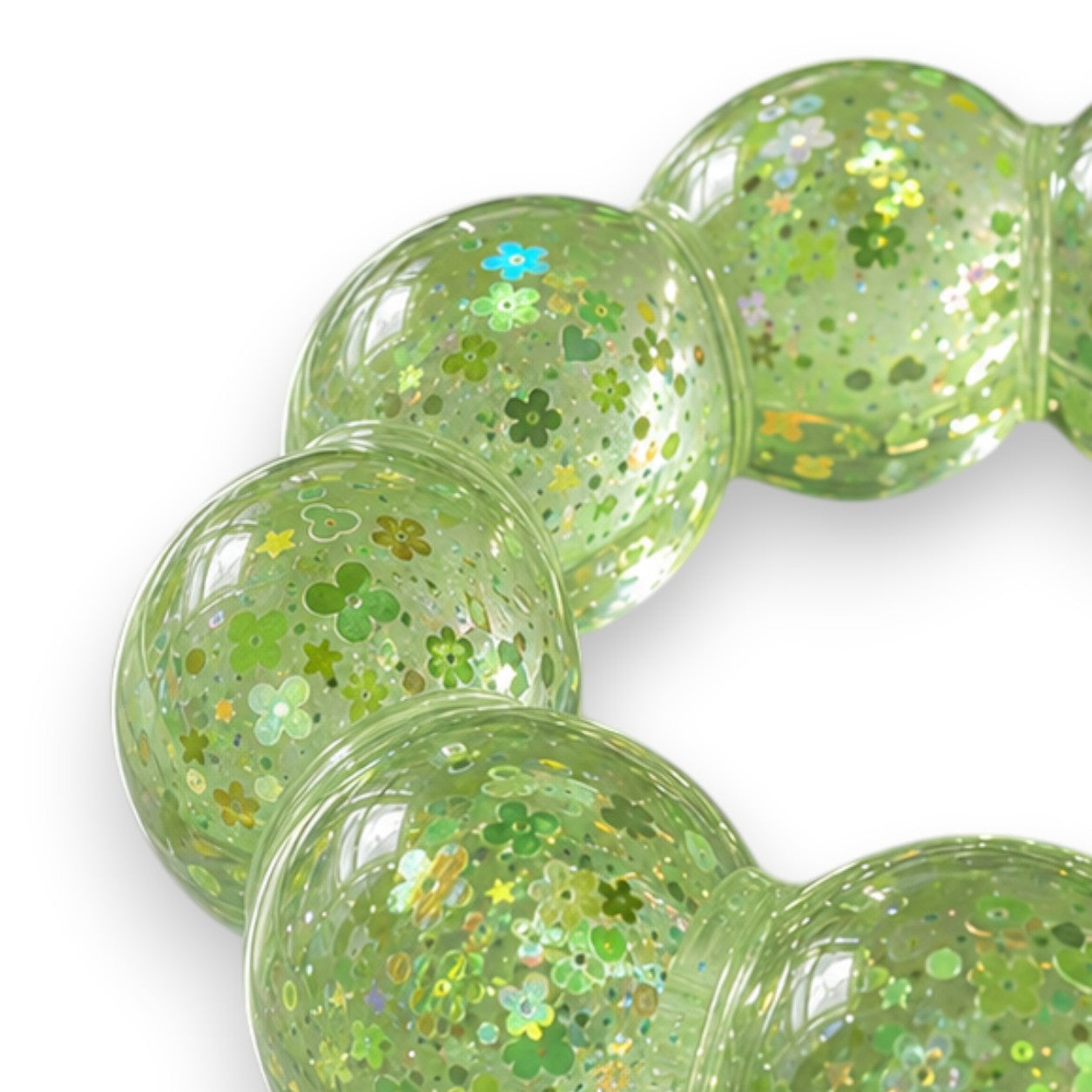 Mellow Monkey Lime Pop Feelzies sensory bracelet with green glitter and flower confetti in a squishy ring design.