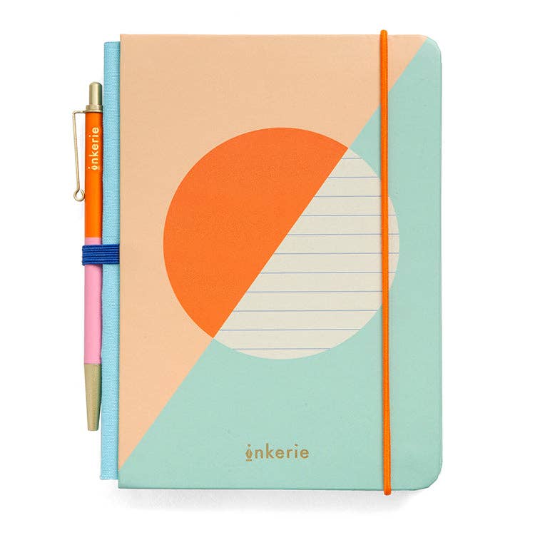 Mellow Monkey lined mini notebook with a matching pen, featuring a geometric peach, orange, and teal cover design.