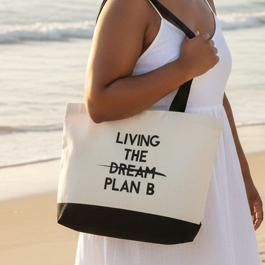 Mellow Monkey white cotton tote bag with black handles and "LIVING THE DREAM PLAN B" text. Features a black base.