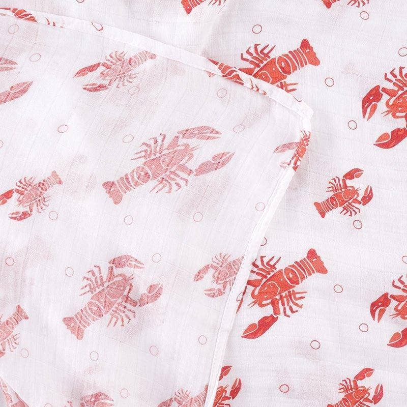 Mellow Monkey extra large muslin swaddle blanket in white with a red lobster print pattern