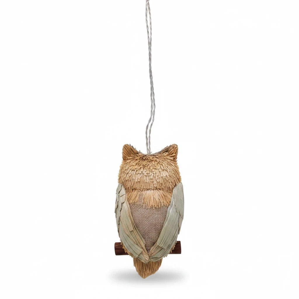Mellow Monkey 4-inch long eared gray owl Christmas ornament made from natural pine fibers and seeds on a branch