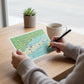 Mellow Monkey Long Island map postcard with illustrations of towns, boats, and a sun. 4" x 6" cardstock.