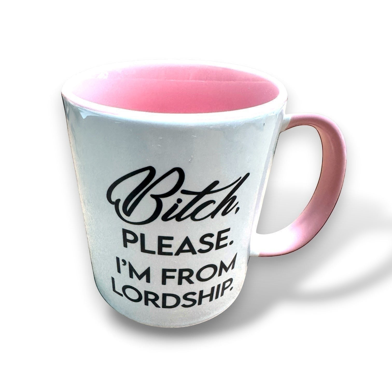 Mellow Monkey white ceramic 11-oz coffee mug with pink interior and handle, featuring black text that reads "Bitch, Please. I'm From Lordship."