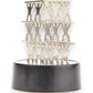 Mellow Monkey magnetic desktop sculpture featuring stacked stainless steel acrobat figures on a black base.