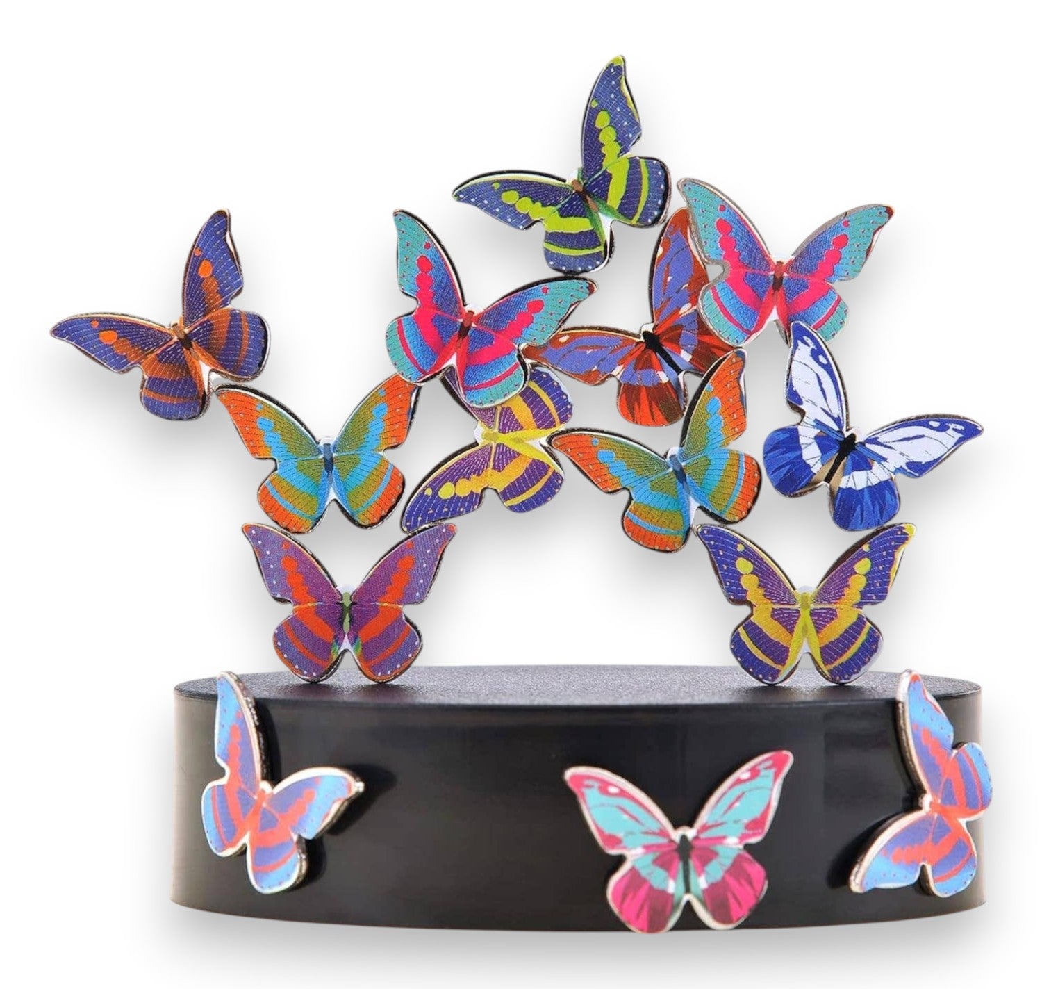 Mellow Monkey magnetic desktop sculpture featuring colorful butterfly-shaped stainless steel pieces on a black base.