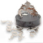 Mellow Monkey magnetic dolphin desktop sculpture with polished stainless steel pieces on a black circular base.