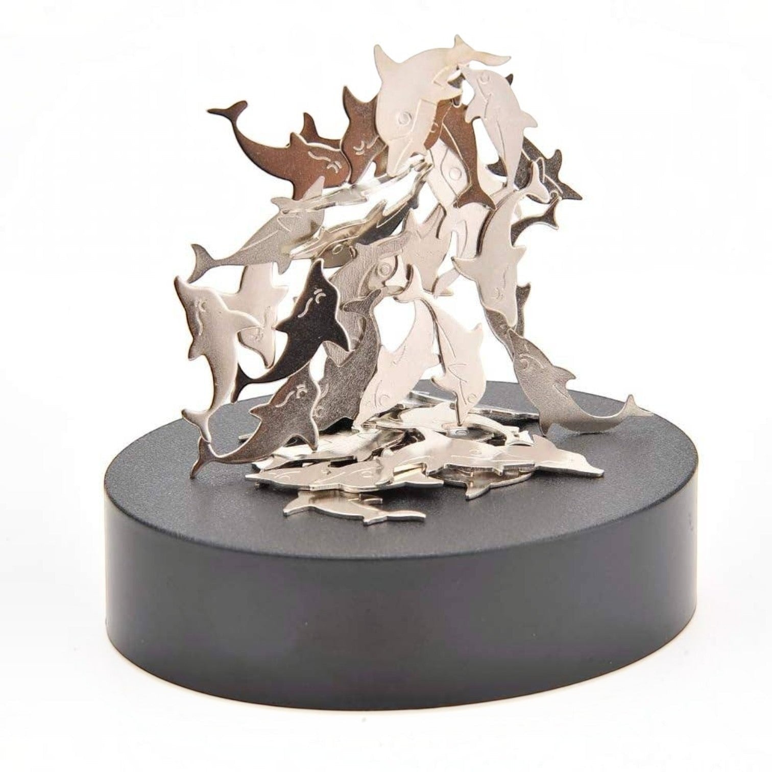 Mellow Monkey magnetic desktop sculpture featuring polished stainless steel dolphin figures on a black base.