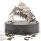 Mellow Monkey magnetic dolphin desktop sculpture with polished stainless steel figures on a black circular base.