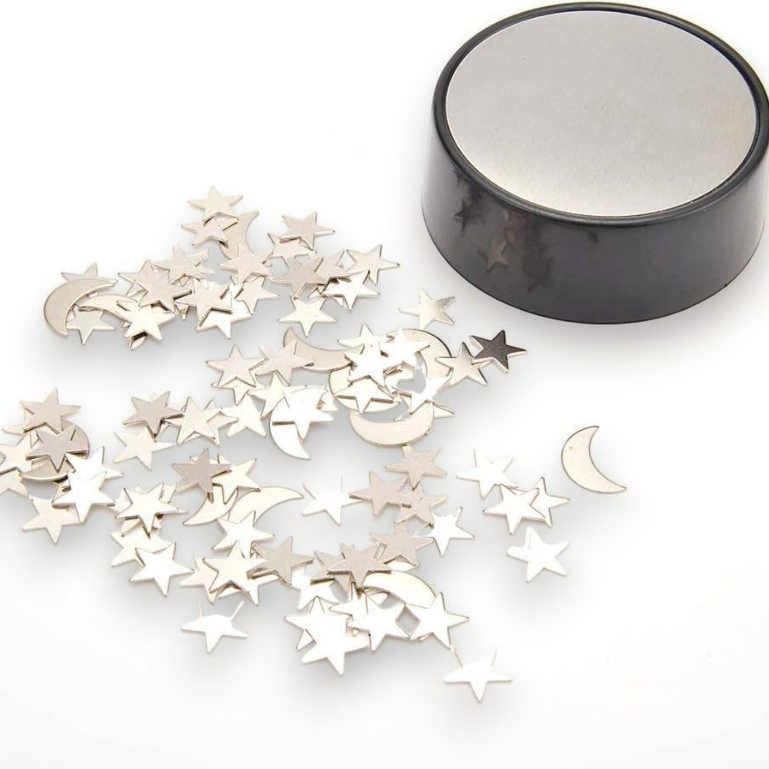 Mellow Monkey magnetic desktop sculpture with polished stainless steel moon and star pieces on a circular base.