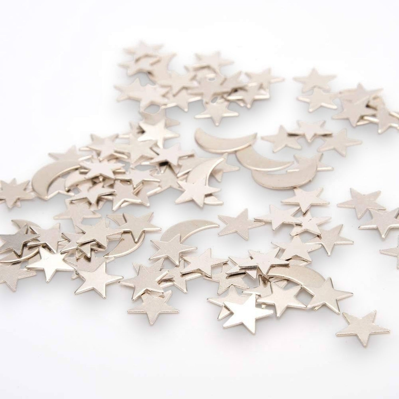 Mellow Monkey magnetic desktop sculpture set with polished stainless steel moon and star pieces for creative desk decor.