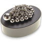 Mellow Monkey magnetic sculpture desk toy with silver stainless steel balls on an oval black base.