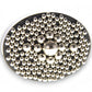 Mellow Monkey magnetic sculpture desk toy featuring polished stainless steel balls arranged on a black oval base.