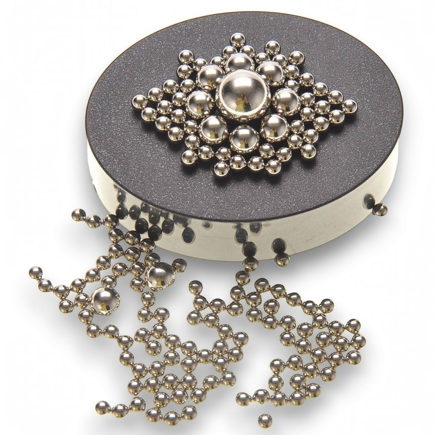 Mellow Monkey magnetic sculpture desk toy with stainless steel balls arranged on a circular black magnetic base.