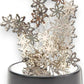 Mellow Monkey magnetic desktop sculpture featuring silver stainless steel snowflake pieces on a black base