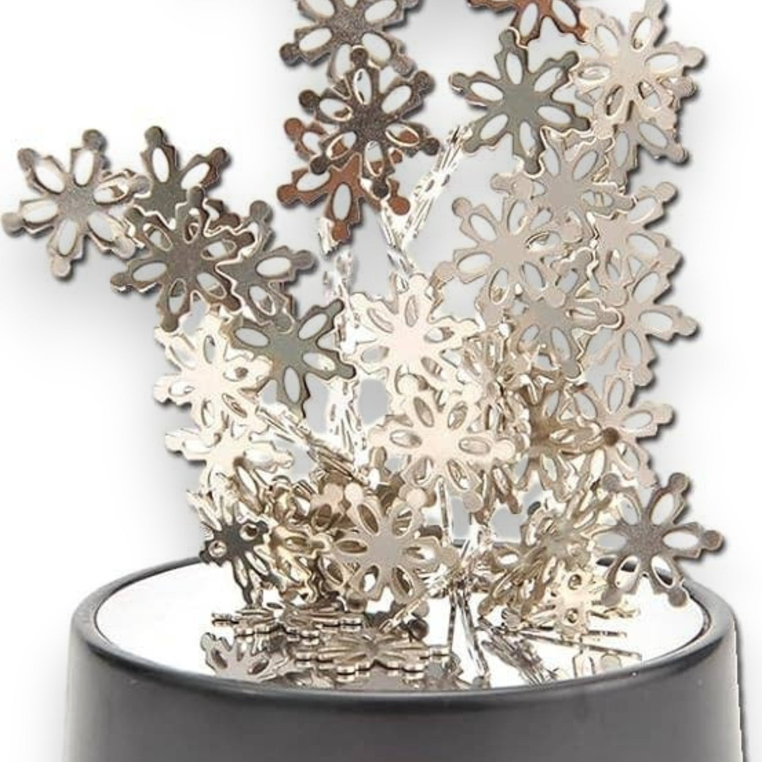 Mellow Monkey magnetic desktop sculpture featuring silver stainless steel snowflake pieces on a black base