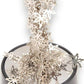 Mellow Monkey magnetic desktop sculpture featuring silver stainless steel snowflake pieces on a circular base.