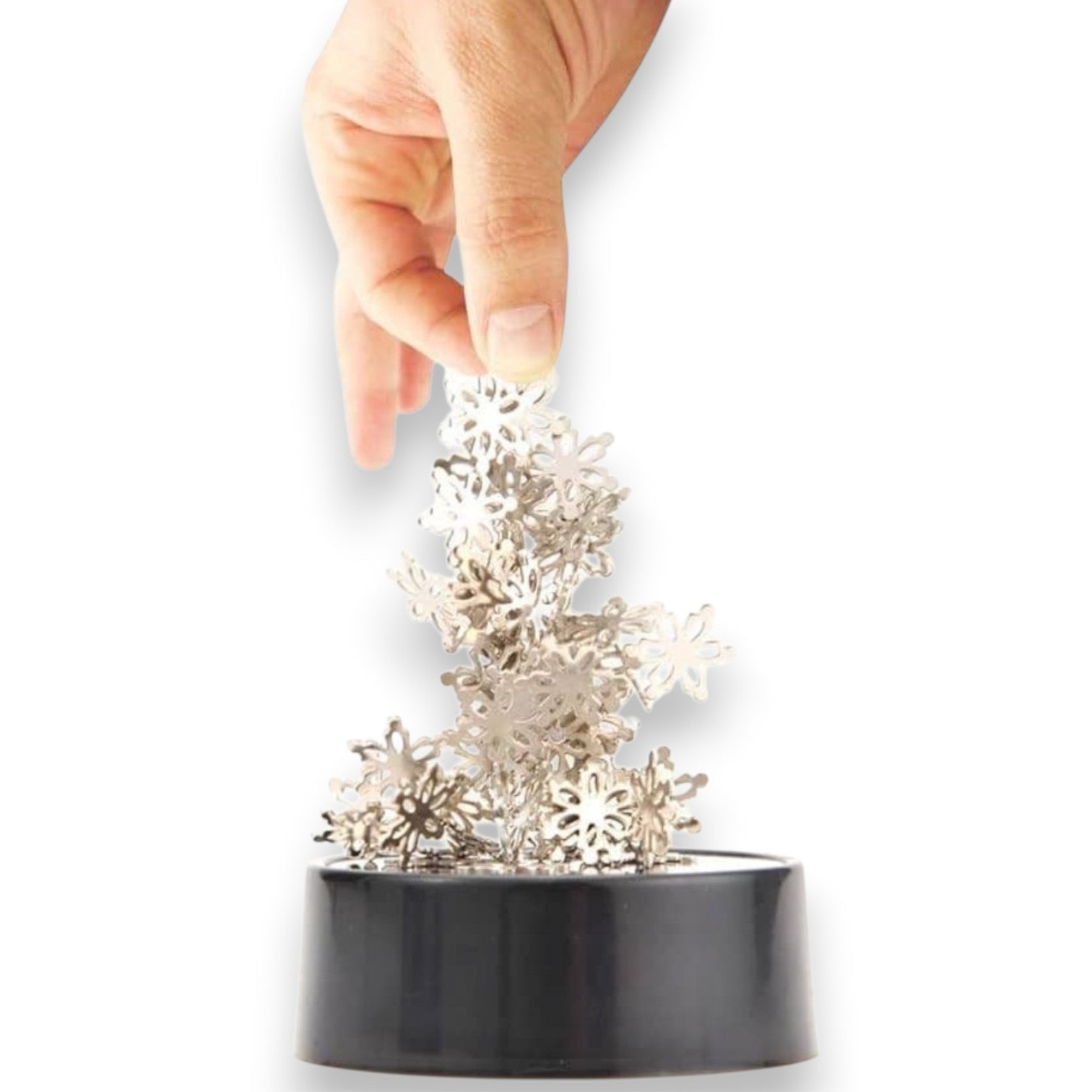 Mellow Monkey magnetic desktop sculpture with stainless steel snowflake pieces arranged on a black base