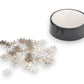 Mellow Monkey magnetic desktop sculpture set featuring small stainless steel snowflake pieces and a black base.