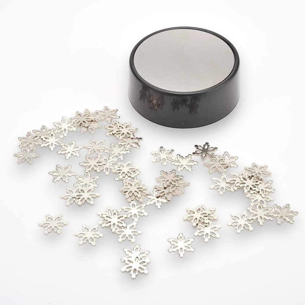 Mellow Monkey magnetic desktop sculpture with stainless steel snowflake pieces and a circular magnetic base.