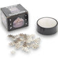 Mellow Monkey magnetic desktop sculpture set featuring silver stainless steel snowflake pieces and a black base.