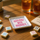 Mellow Monkey ceramic Mahjong With Mahgirls trinket tray with pink and blue text on a wooden table with game tiles.