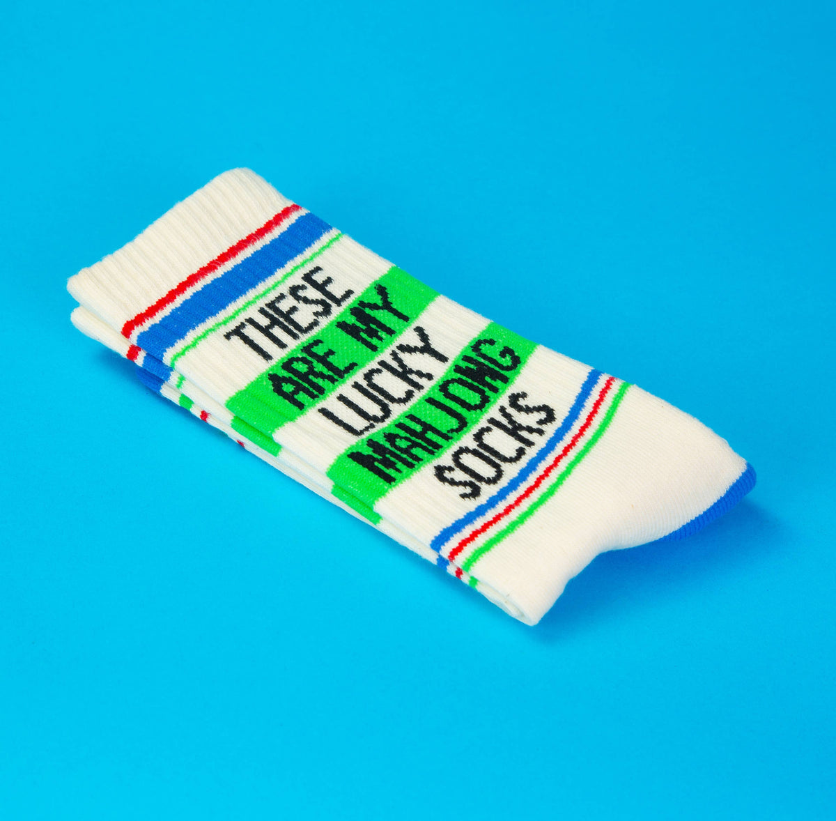 Mellow Monkey cream gym crew socks featuring green text that reads These Are My Lucky Mahjong Socks with blue trim