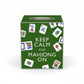 Mellow Monkey green papier mache tissue box cover featuring Keep Calm and Mahjong On text and mahjong tile graphics.