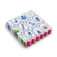 Mellow Monkey 3-ply paper cocktail napkins featuring a colorful Mahjong tile print and decorative scalloped edges.