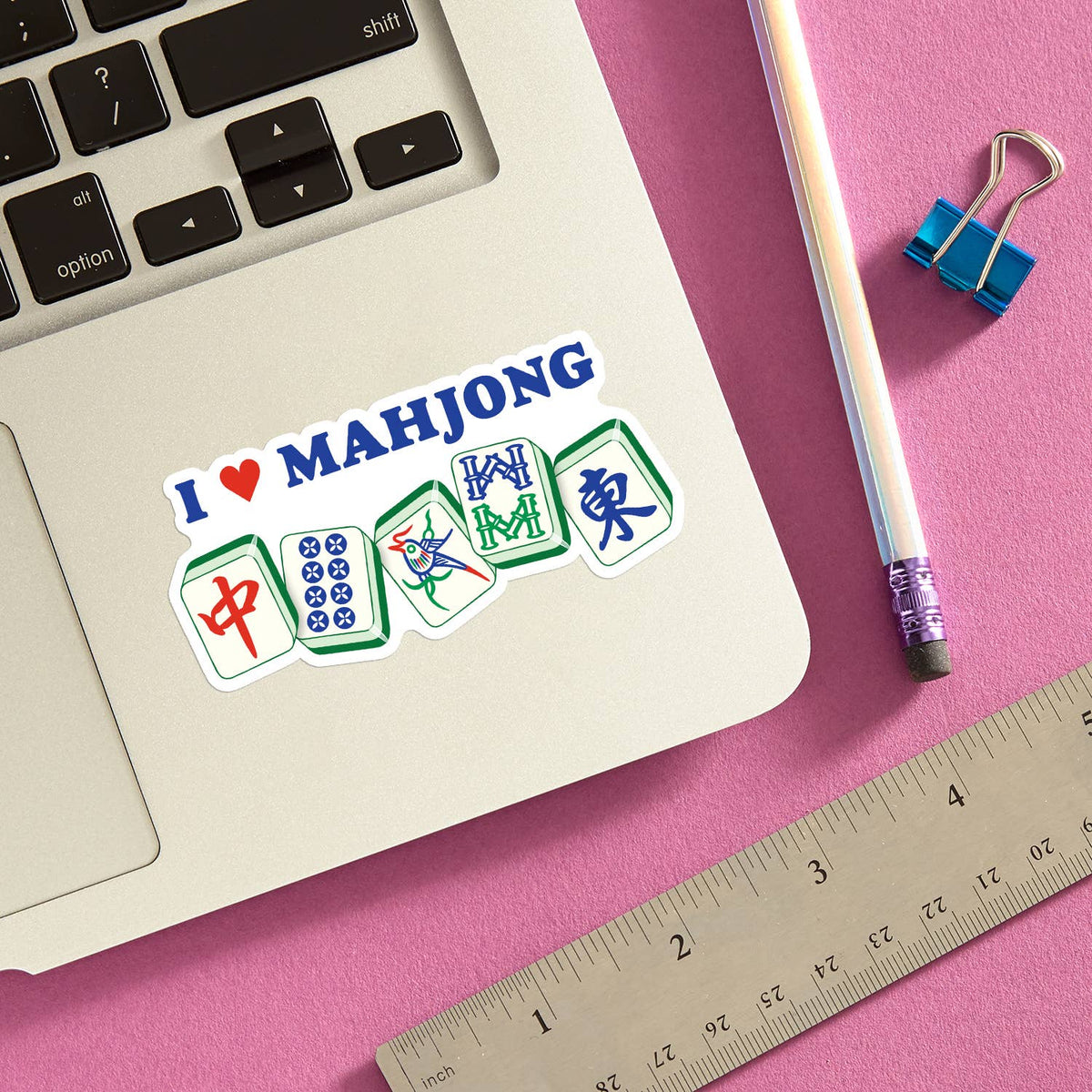 Mellow Monkey I Heart Mahjong die cut vinyl sticker on a laptop, featuring mahjong tiles and a red heart icon.