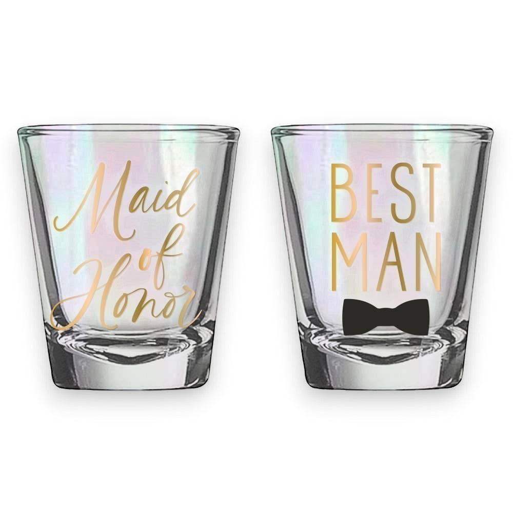 Mellow Monkey set of 2 iridescent shot glasses, one reads "Maid of Honor" and the other "Best Man" with a bow tie graphic.