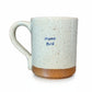 Mellow Monkey speckled stoneware mug with Mama Bird text in blue on a cream background