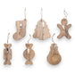 Mellow Monkey mango wood serving boards and canape knife sets in six festive holiday shapes tied with jute twine.