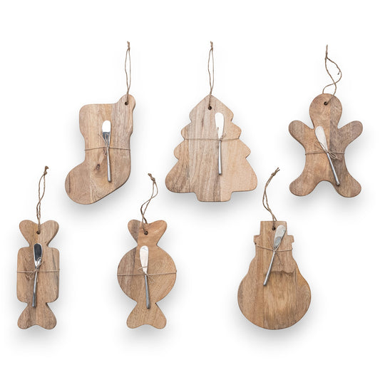 Mellow Monkey mango wood serving boards and canape knife sets in six festive holiday shapes tied with jute twine.